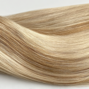 Close-up of light blonde Hair Extension Genius Wefts showing silky smooth texture and natural shine.