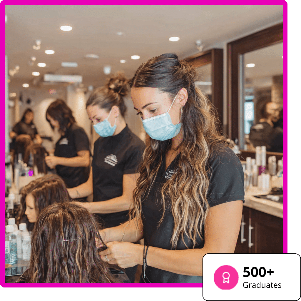 Young adults in their 20s-30s focused on learning techniques in a modern, warm-toned Hair Extension Academy environment.